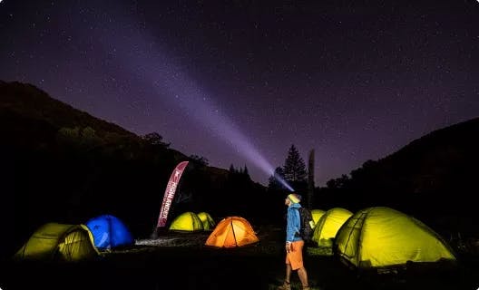 Night sky with glowing tents